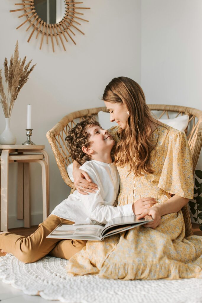 pexels-photo-4609087-4609087 A mother and son sharing a warm moment at home with a cozy interior.